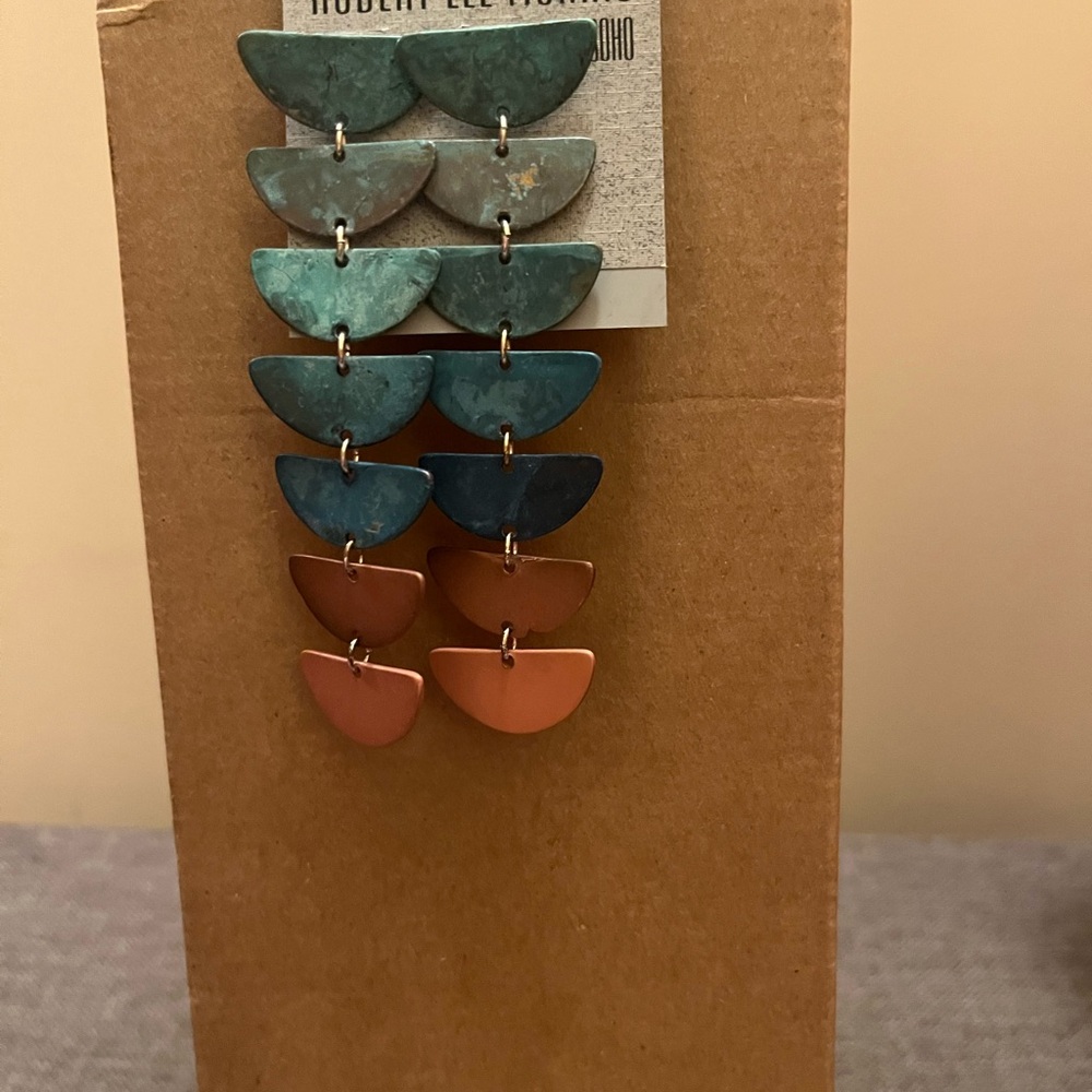 Robert Lee Morris Soho dangle earrings.
Variegated patina charms, about 4".